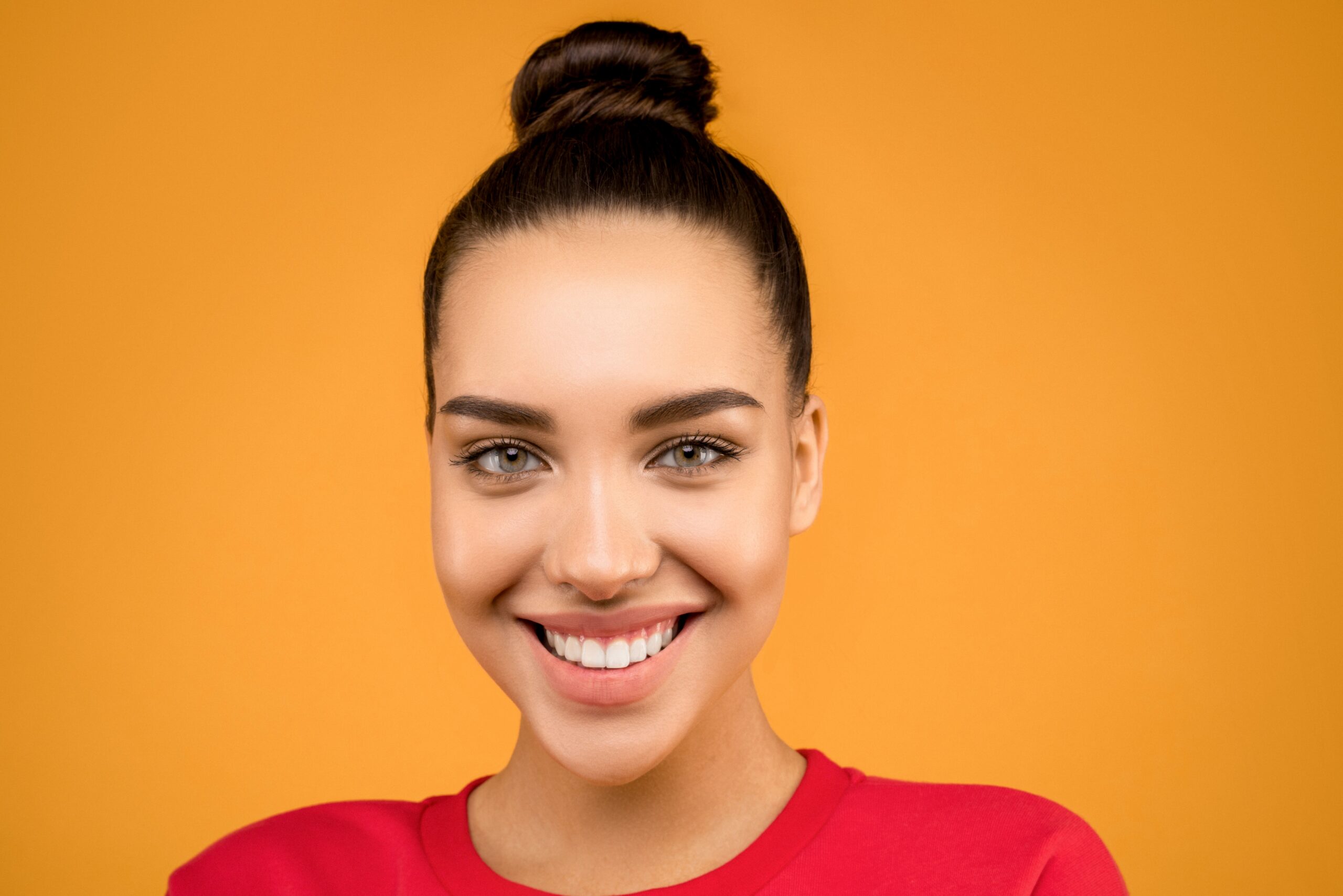 Patient with a brighter smile after professional teeth whitening